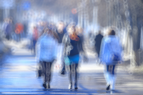 blurred image of a people walking in the street